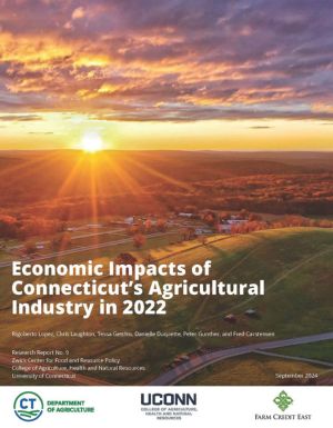 Sunrise in fall over a farmland with rolling hills in the background